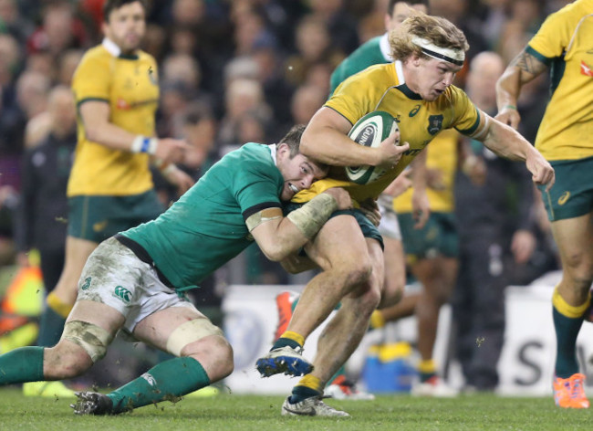 Michael Hooper is tackled by Peter O'Mahony