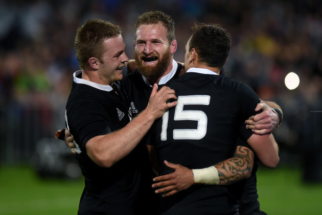 Aaron Smith is congratulated by Kieran Read and Israel Dagg after scoring a try