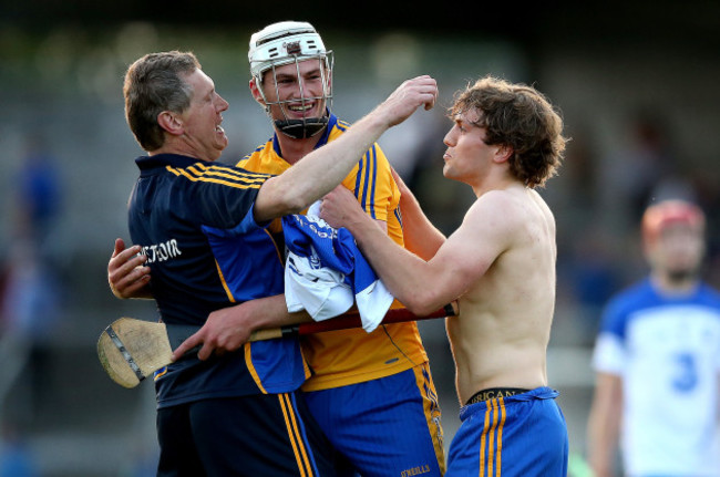 Conor Cleary celebrates at the final whistle with joint manager Donal Moloney and Shane OÕDonnell