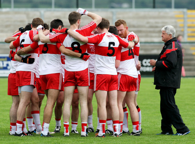 Brian McIver joins the pre-match team huddle