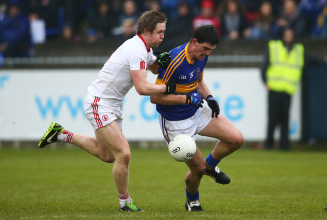 Colin OÕRiordan is tackled by Frank Burns