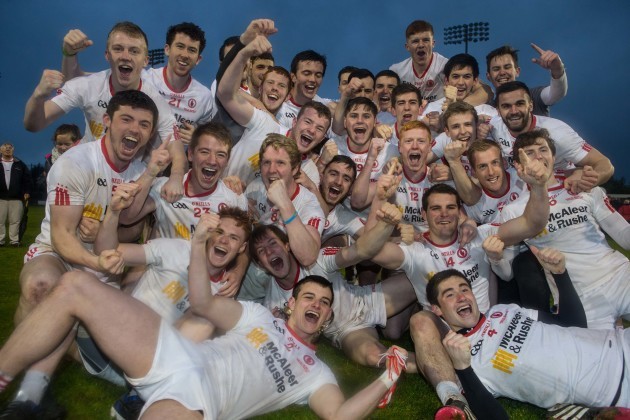 Tyrone players celebrate with the cup