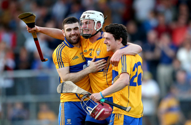 Conor Cleary celebrates at the final whistle with Brian Carey and Diarmuid Moloney