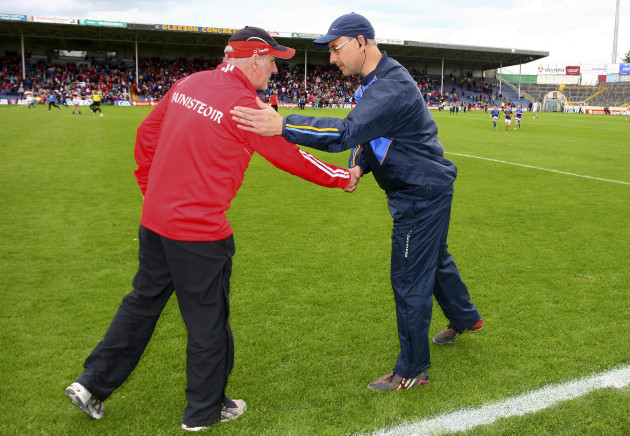 Mickey Harte is congratulated by Peter Creedon after the game