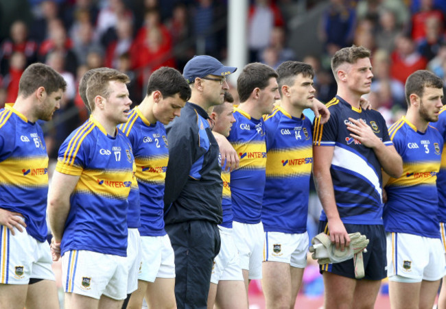 Peter Creedon lines up with the players for the national anthem