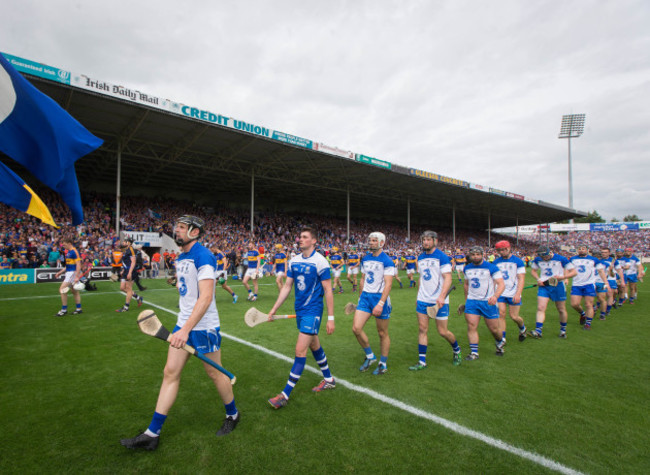 Kevin Moran leads his team during the parade