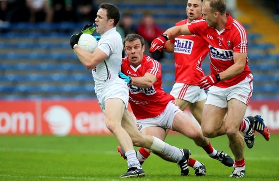 Cathal McNally is fouled by James Loughrey