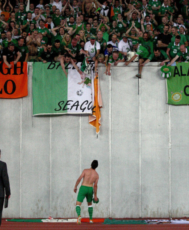 Shane Long throws his jersey to supporters after the game