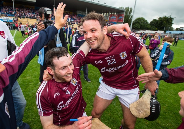 Padraig Mannion and David Collins celebrate after the game