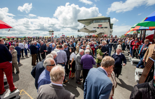 A view of racegoers in the parade ring