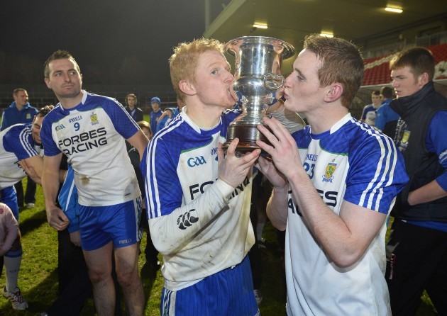 Coilin and Aaron Devlin celebrate with the trophy