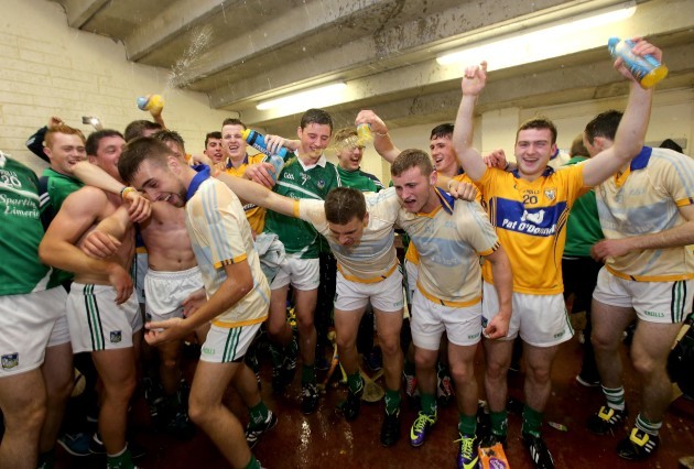 Clare player celebrate in the dressing rooms after the game