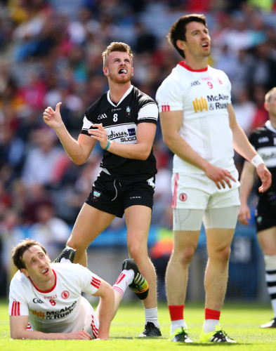 Cian Breheny watches a point attempt with Colm Cavanagh and Mattie Donnelly