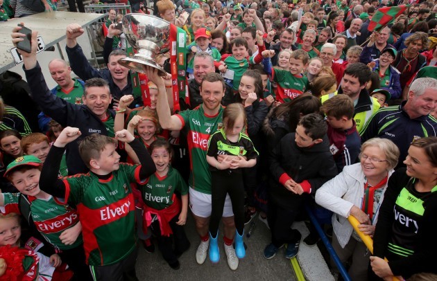 Keith Higgins celebrates with supporters as he raises The Nestor Cup