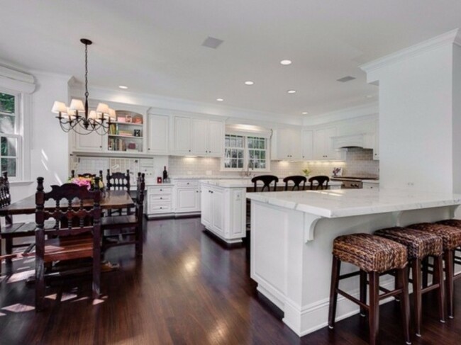 with-two-dishwashers-a-center-island-breakfast-bar-desk-area-and-plenty-of-counter-space-the-gourmet-kitchen-is-a-cooks-dream