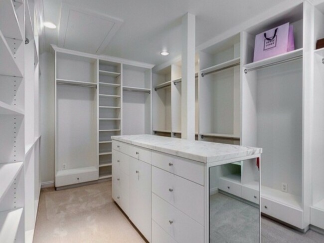 theres-no-need-to-fight-over-closet-space-with-a-walk-in-closet-like-this