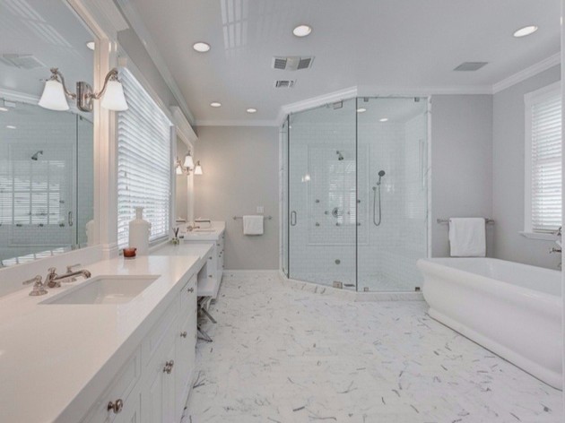 a-steam-shower-soaking-tub-and-his-and-her-sinks-line-the-walls-of-the-master-bath