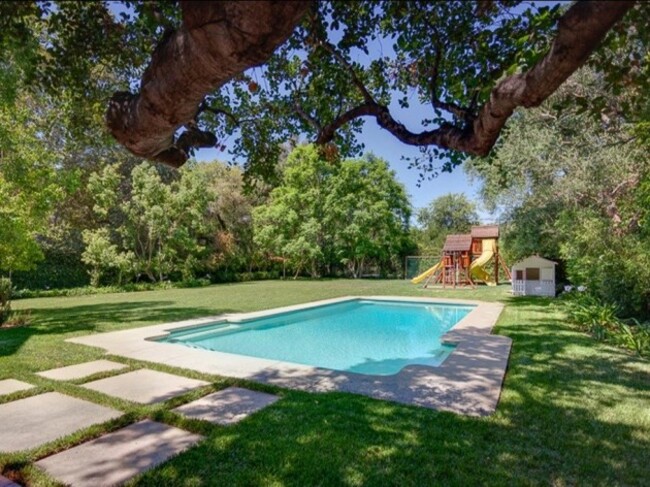 with-more-than-three-acres-the-estate-includes-a-saltwater-pool-and-playground