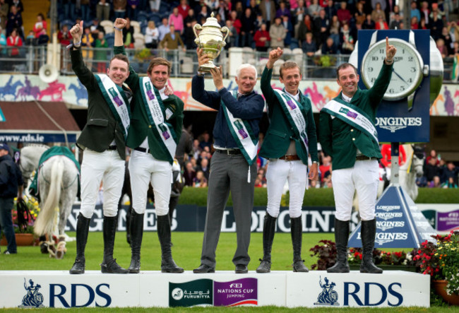 Robert Splaine with The Furusiyya FEI Nations Cup as Team Ireland celebrate