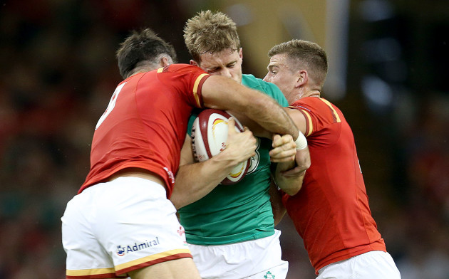 Andrew Trimble tackled by Mike Phillips and Scott Williams