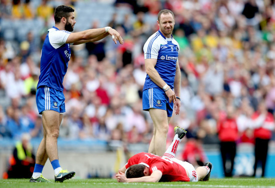 Neil McAdam and Vinny Corey react as Sean Cavanagh wins a free