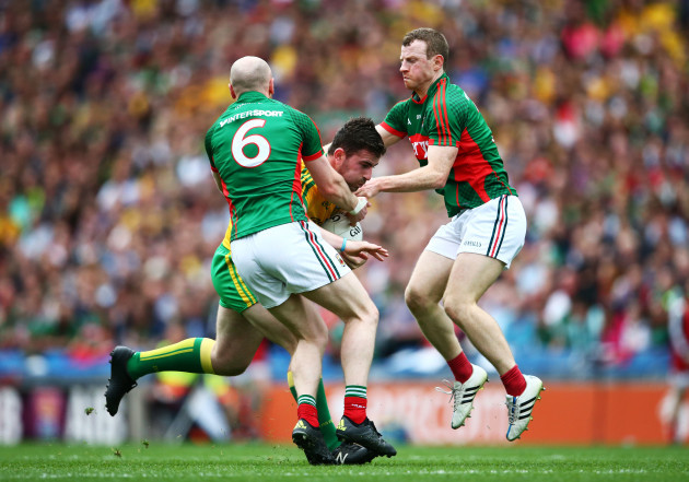 Tom Cunniffe and Colm Boyle tackle Patrick McBrearthy