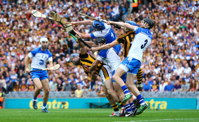 Kilkenny and Waterford players battle for possession