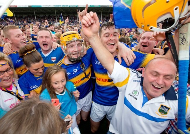 Lar Corbett and Seamus Callanan celebrate with fans after the game