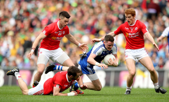 Richie Donnelly, Ronan McNamee and Peter Harte tackle Conor McManus