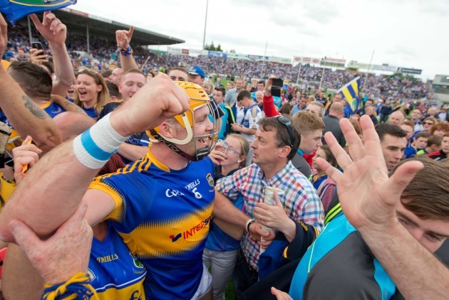 Padraic Maher celebrates with fans after the game