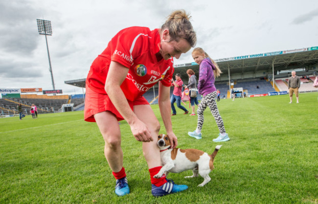 Briege Corkery dog Hernandez greets her after the game