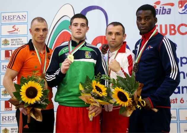 Joe Ward celebrates with his gold medal on the podium