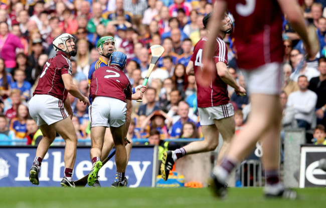 Noel McGrath watches as he scores a point