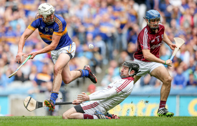 Colm Callanan and Johnny Coen prevent Patrick Maher scoring a goal