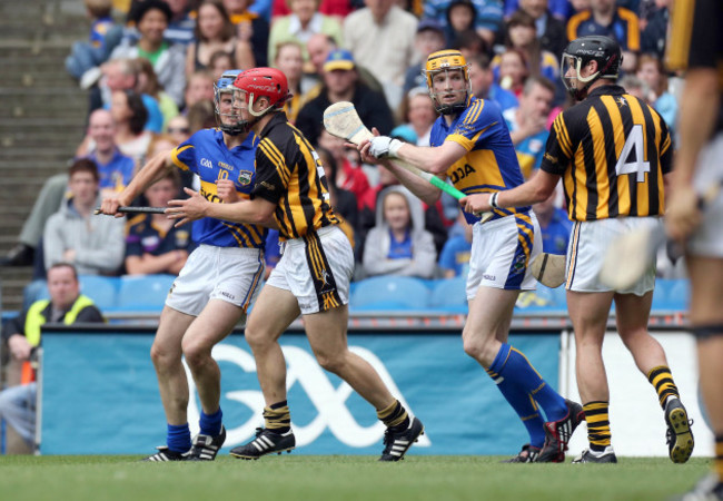 Lar Corbett and Pa Bourke chase around after Tommy Walsh and Jackie Tyrell in the corner of the canal and Cusack Stand while the ball is at the far end of the pitch