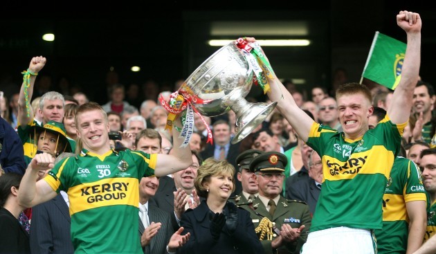 Barry John Walsh and his brother Tommy lift the Sam Maguire
