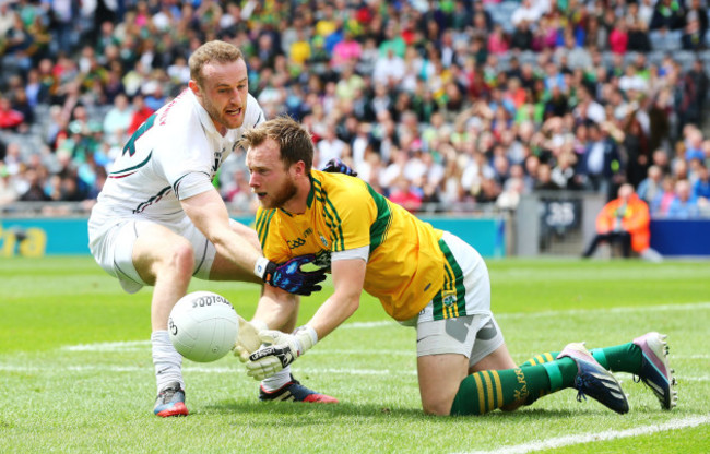 Brendan Kealy under pressure from Alan Smith