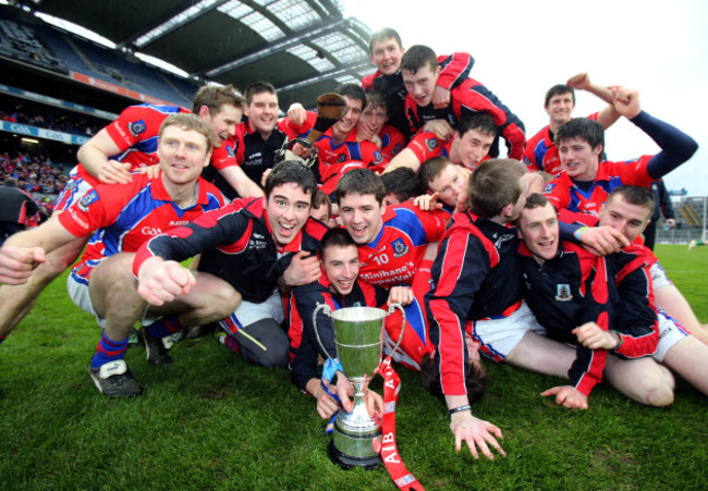 St. Thomas players celebrate with the cup