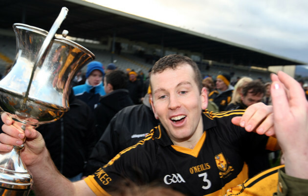 Luke Quinn celebrates with the cup