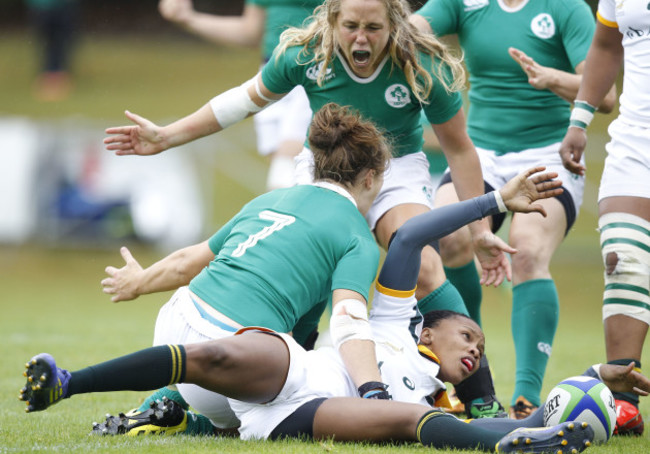 Katie Fitzhenry celebrates her try with Ashleigh Baxter