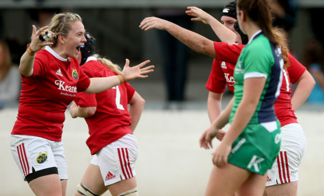 Niamh Briggs celebrates with try scorer Fiona Reidy