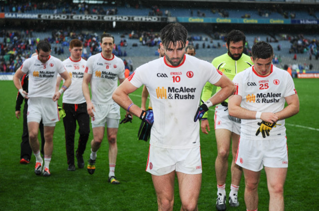 Tiernan McCann and Ronan OÕNeill walk off the field dejected after the game