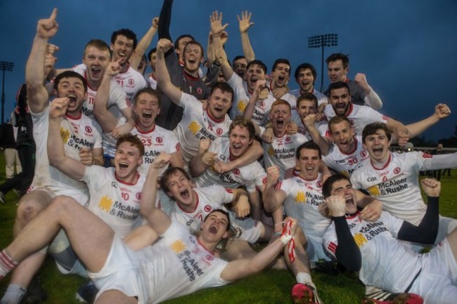 Tyrone players celebrate with the cup