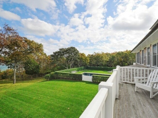 the-grounds-are-meticulously-landscaped-with-plenty-of-open-space-for-charlotte-to-run-and-play