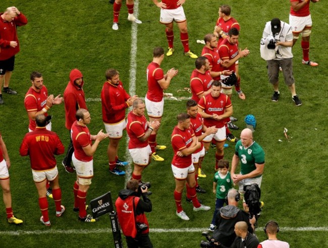 Welsh players applaud off Paul O'Connell with his son Paddy after the game