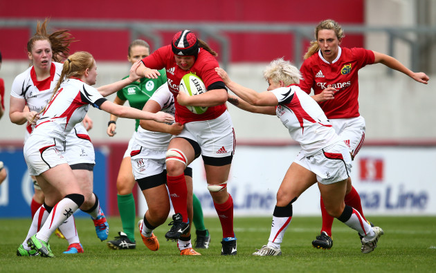 Roisin Ormond is tackled by Kathryn Dane and Niamh Fitzgerald