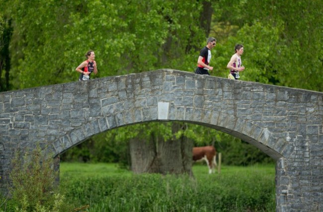Competitors competing the run in the Olympic category race