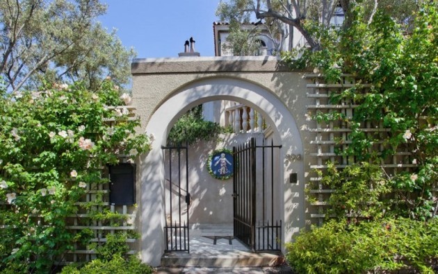 the-house-is-surrounded-by-lush-gardens-and-olive-trees