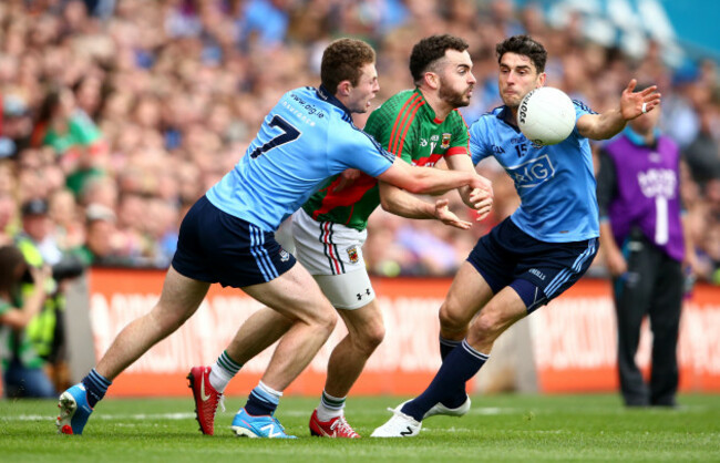 Jack McCaffrey and Bernard Brogan tackle David Drake