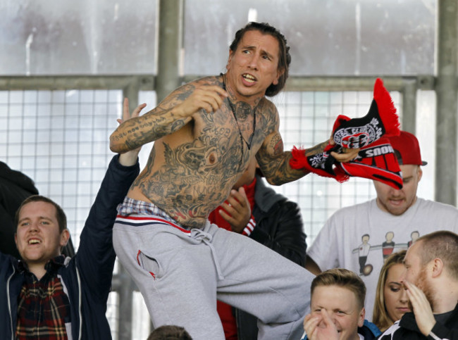 A Bohemians fan celebrates their goal